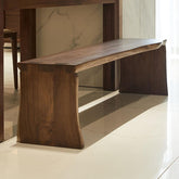 Close-up of the grain pattern on the wooden surface of the dining bench